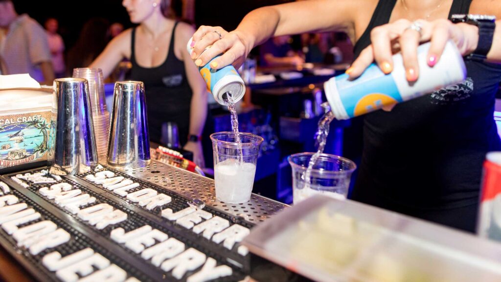 Bartender pours drinks at Square Grouper Tiki Bar Jupiter